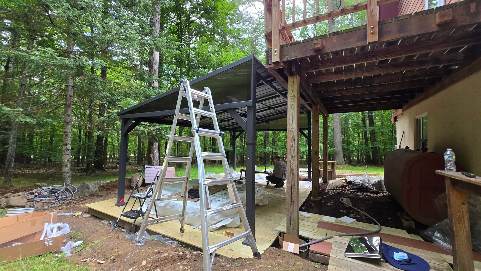 Byunghun working on the deck cover structure at the Adirondack cabin