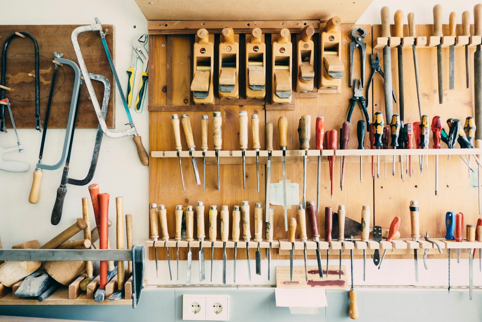 Wall of hand tools in a renovation workshop, general renovation atmosphere